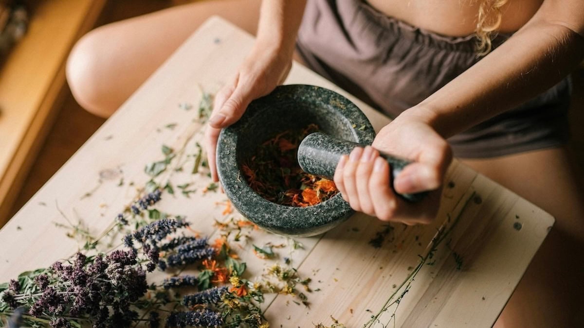Using mortar and pestle with herbs