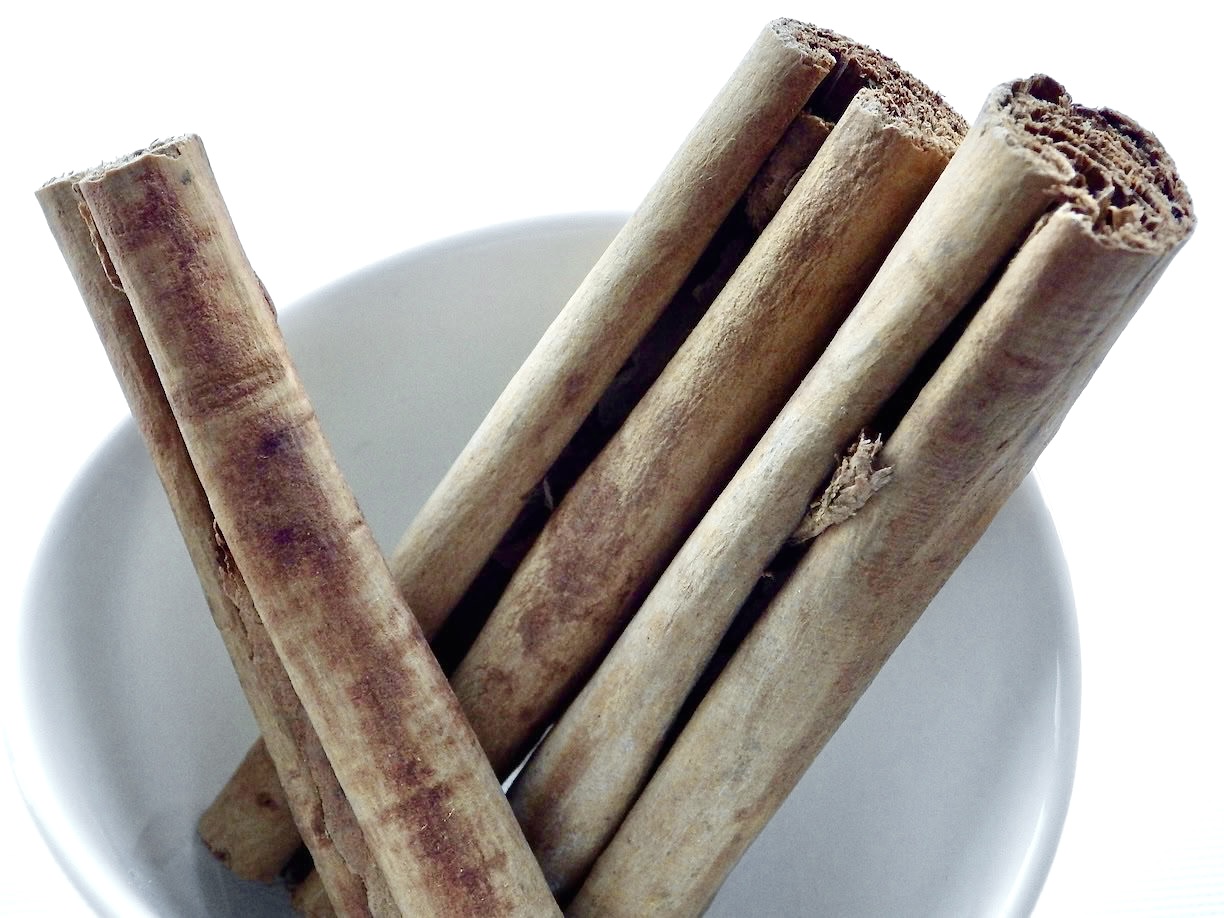 Ceylon cinnamon quills in white bowl
