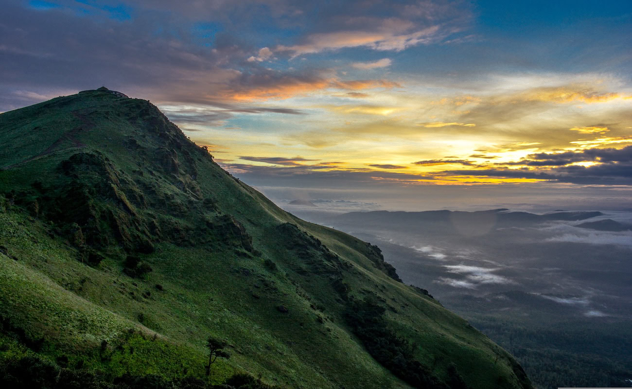 The Western Ghats, Southwest India. A gorgeous, verdant mountain range overlooking a stunning sunset.