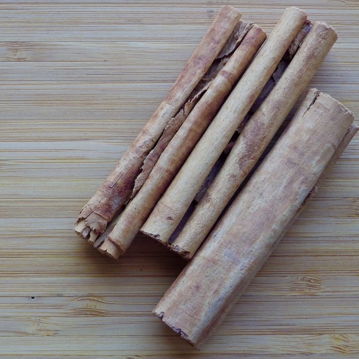 Ceylon cinnamon sticks on wood