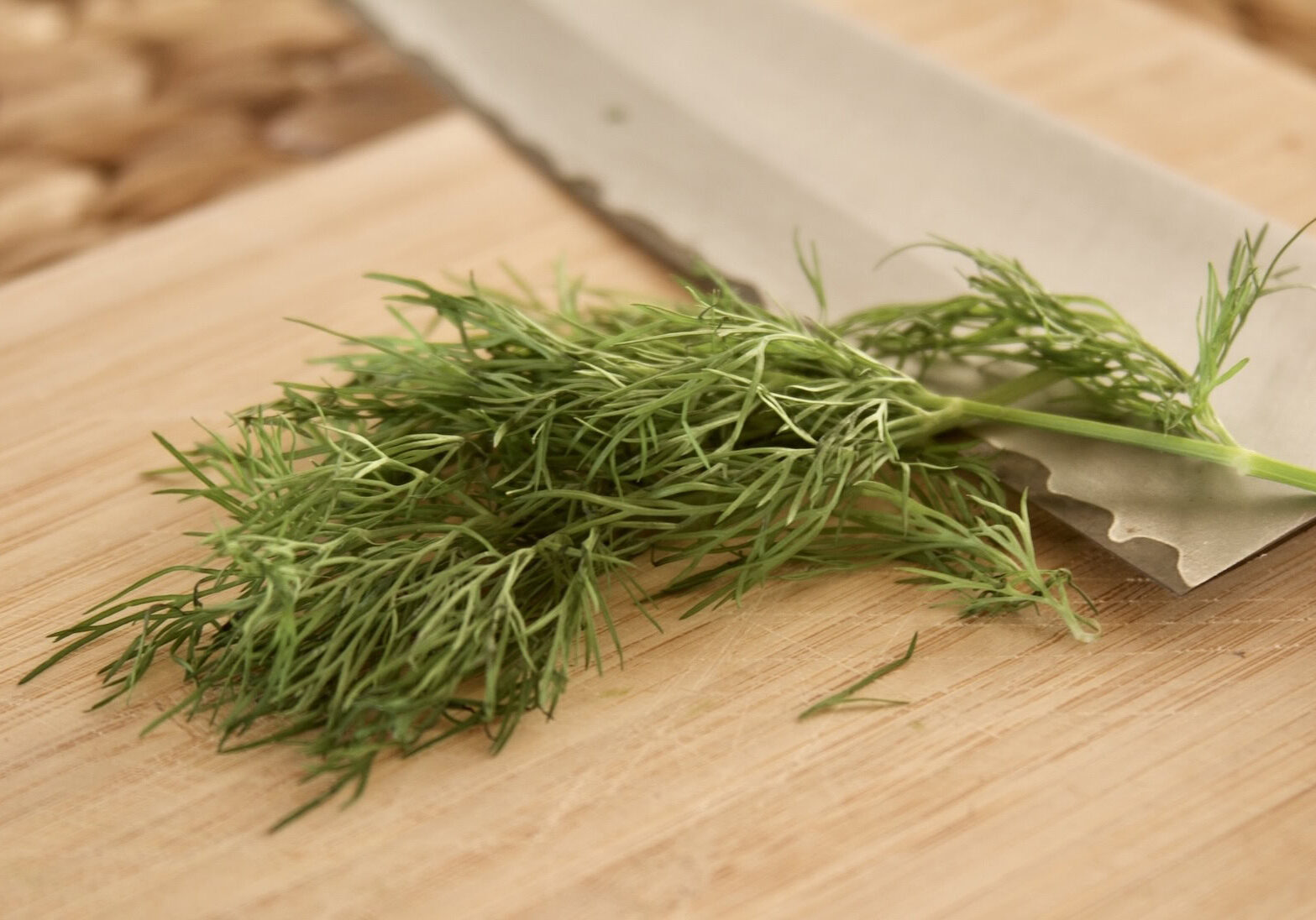 Dill weed on cutting board