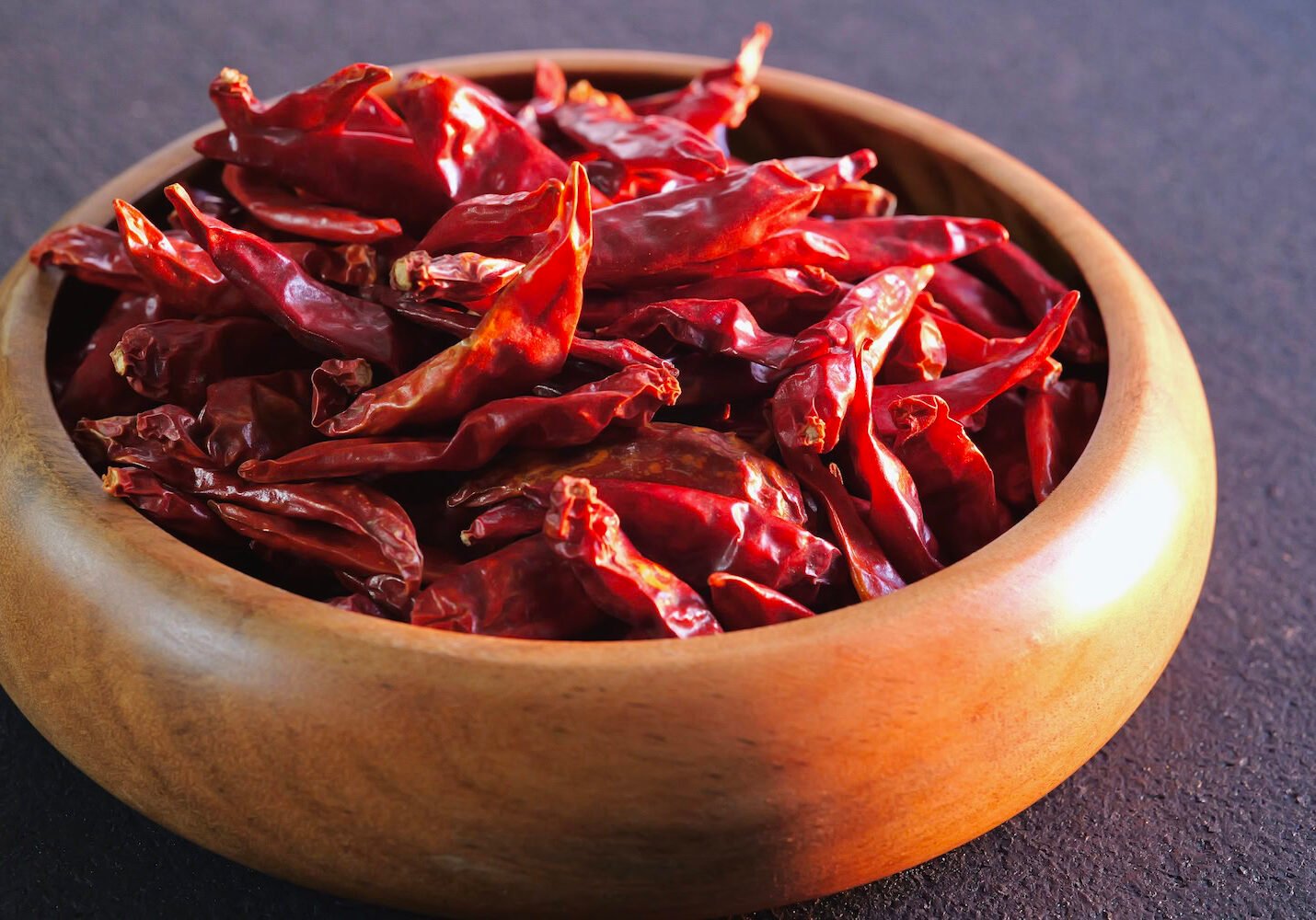 dried-chile-peppers-wooden-bowl-sunshine dried-chile-peppers-wooden-bowl-sunshine
