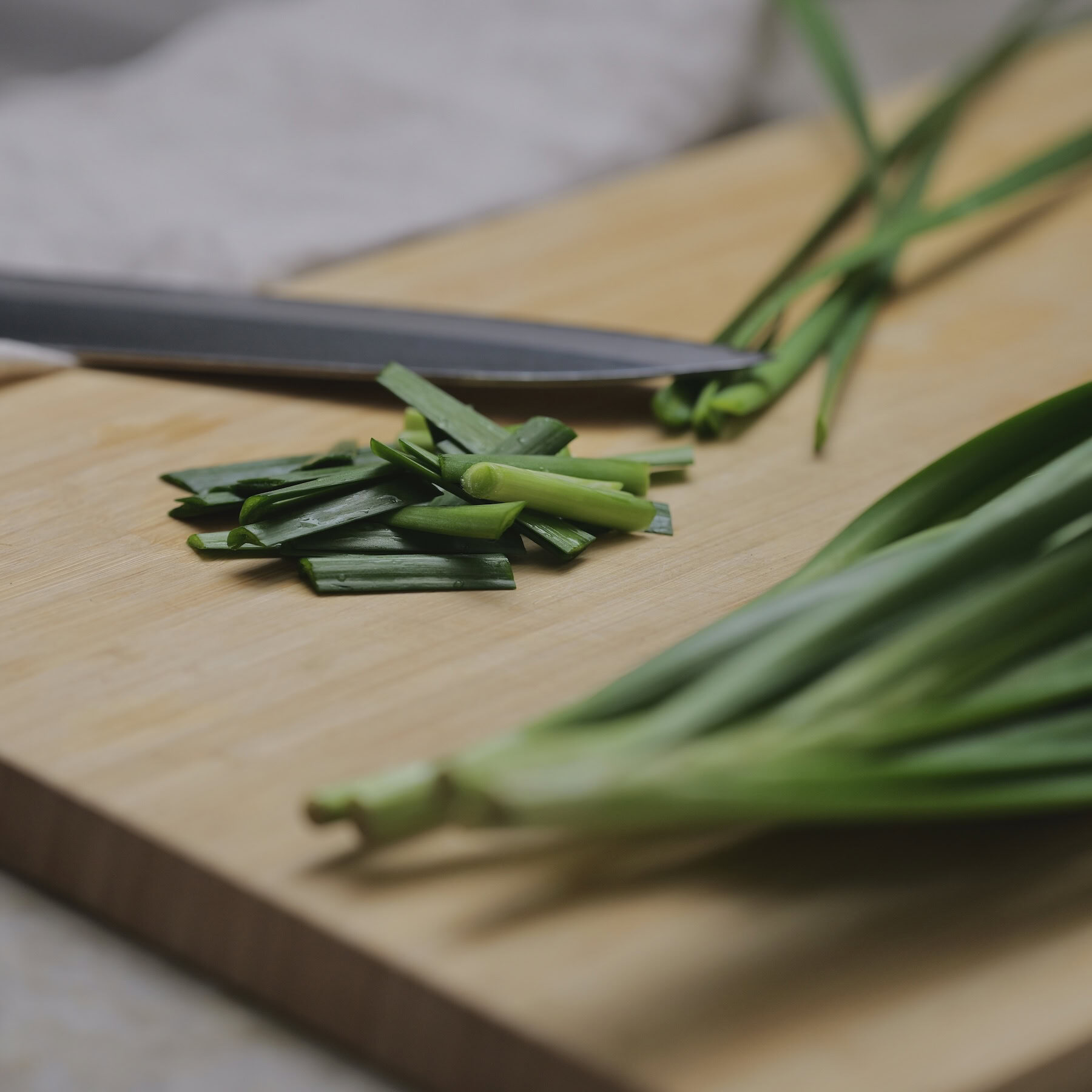 garlic-chives-chopped-on-cutting-board
