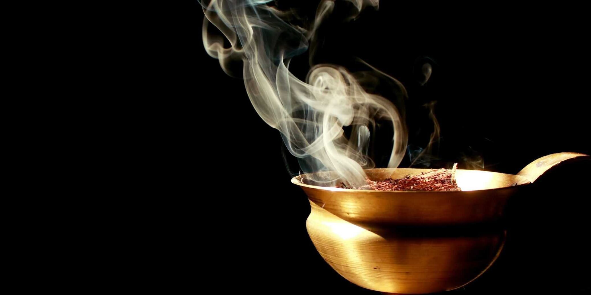 Incense in gold bowl