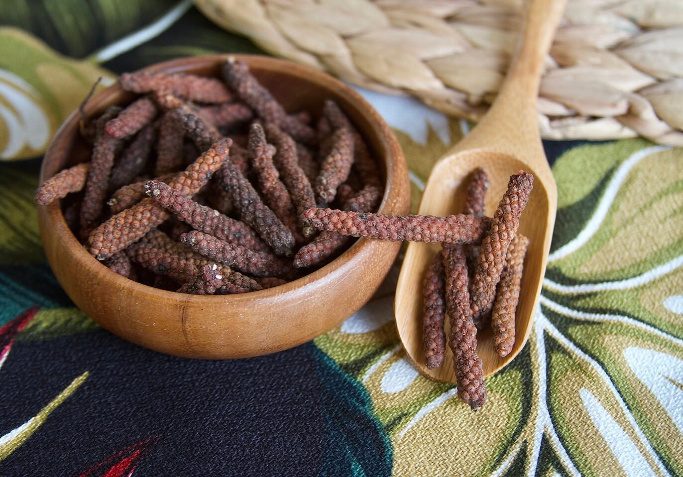 Long pepper fruits in bowl and spoon