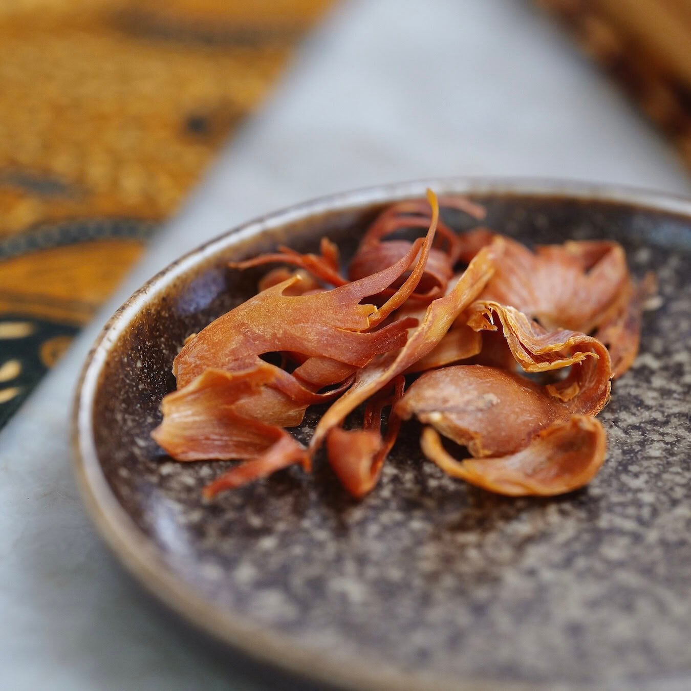 mace-ceramic-plate-patterned-fabric