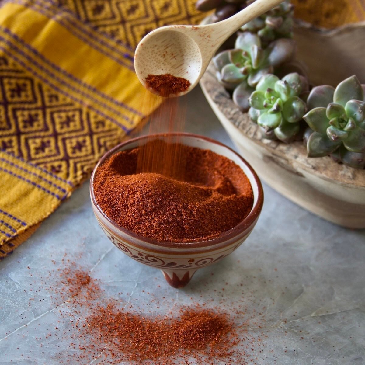 Paprika pouring into bowl